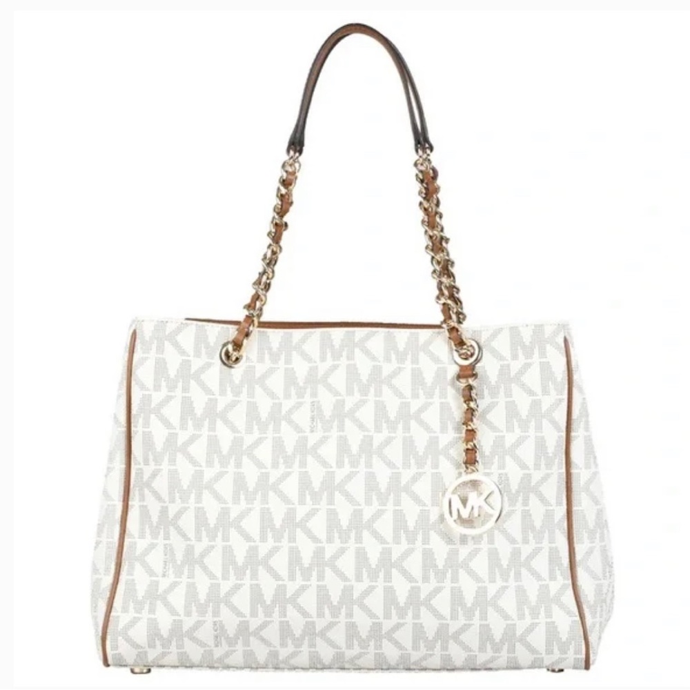 Used one time! beautiful bag! fits so much! Got it from the Michael Kors store!